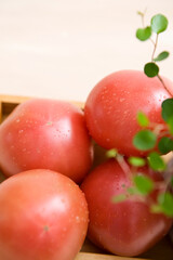 tomato in wooden plate