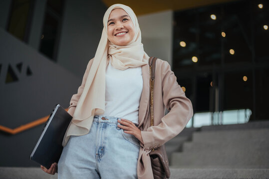 Muslim Businesswoman Smiling In Hijab. Potrait Of Muslim Asian Woman.