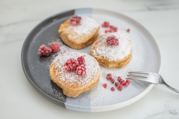 sweet home made vanilla pancakes with raspberries