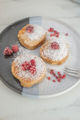 sweet home made vanilla pancakes with raspberries