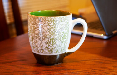 cup of coffee on wooden table