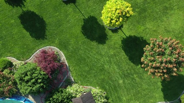 Aerial View Of Lawn And Garden On Warm  Summer Day. Contemporary Garden Design Combining Nature And Comfort In Beautiful Landscape Architecture. 