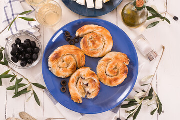 Pastry swirls with cheese and olive filling.
