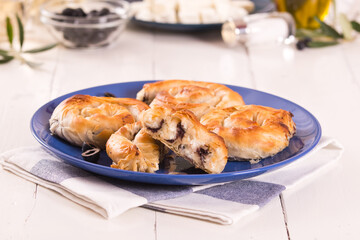 Pastry swirls with cheese and olive filling.
