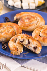 Pastry swirls with cheese and olive filling.

