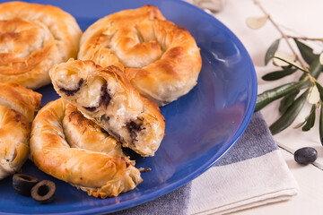 Pastry swirls with cheese and olive filling.
