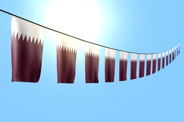 beautiful anthem day flag 3d illustration. - many Qatar flags or banners hanging diagonal on string on blue sky background with soft focus