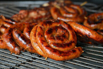 Sai Aua northern Thai spicy sausage on stove.