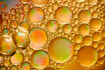 art orange photo of oil drops close up in orange tones for background