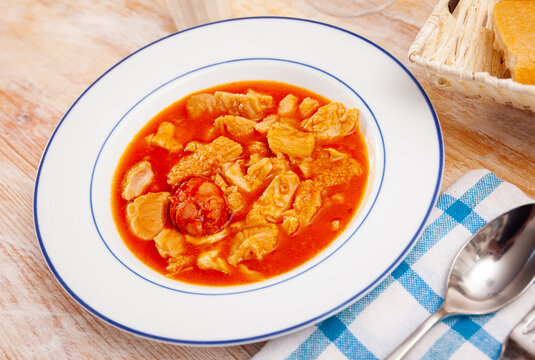 Popular Spanish Callos de ternera, veal tripe braised in tomato sauce garnished with chorizo