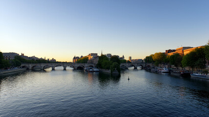 Fototapeta na wymiar Seine river and Pont Neuf bridge in Paris