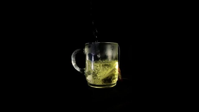 A cup of tea being poured.
Black screen.
in 4K
Black screen cup of thee.