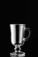 Empty glass cup on dark background