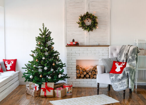christmas interior house decorated tree fireplace armchair