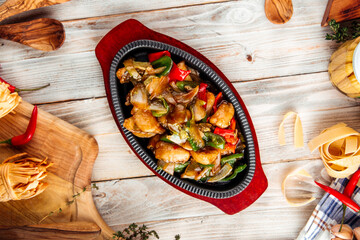 Roasted chicken with vegetables in cast iron pan