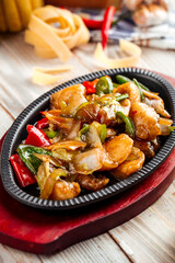 Roasted chicken with vegetables in cast iron pan