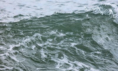 Wave in the sea with splashing water.