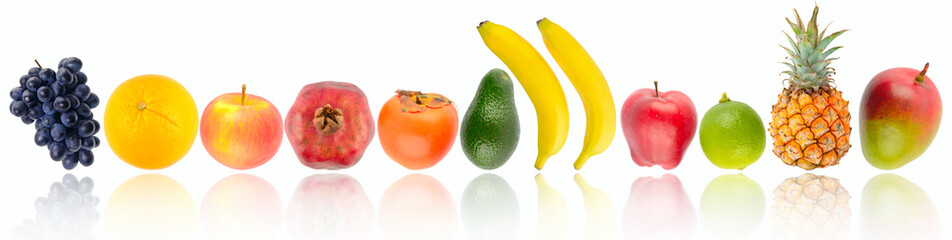 Tropical fruits and vegetables in row with soft reflection isolated on white