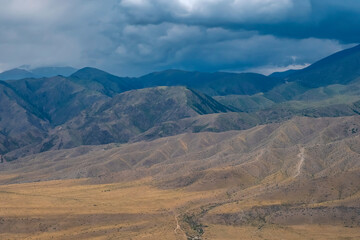 Beautiful mountains with stormy clouds, Summer nature view. Natural summer landscape. Cloud background.