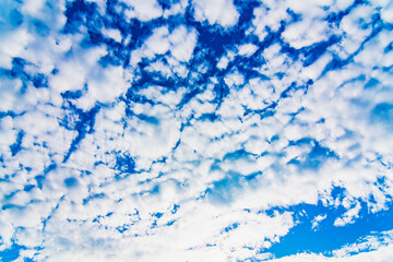 Summer blue sky background with clouds.
