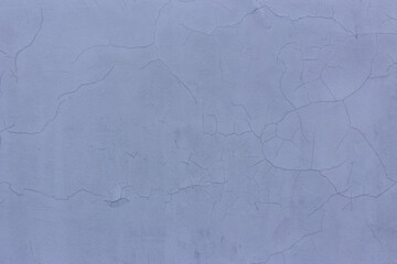 Gray cement wall with cracks