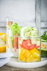 Healthy vegetable salad in jars