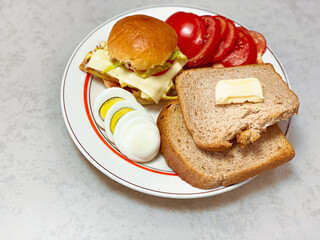 Health vegetarian breakfast : homemade ray fresh bread, egg, fruits and butter.