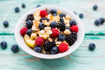 Muesli with fresh berries in a bowl.