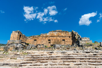 Fototapeta na wymiar Ancient ruins in Hierapolis, Pamukkale, Turkey. The site is a UNESCO World Heritage site
