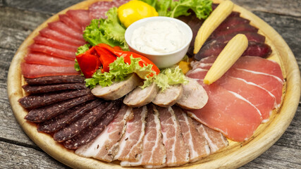 Various of meat on a wooden board. Closeup