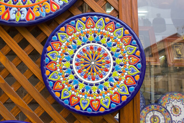 Traditional ceramic handicraft plates in damascening technique for sale from Toledo, Spain 