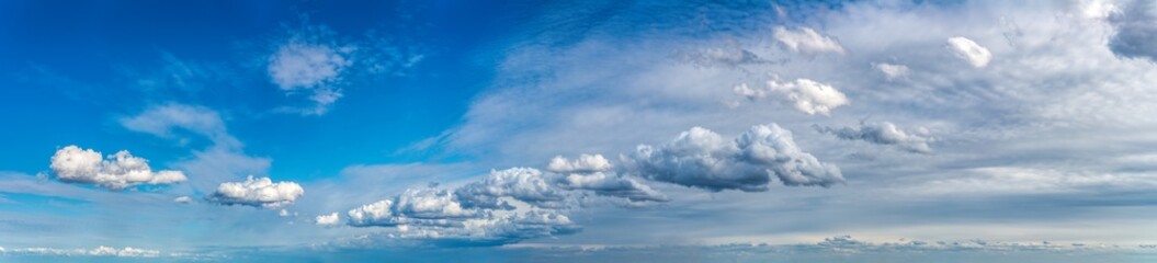 Naklejka na ściany i meble Fantastic clouds against blue sky, panorama