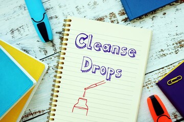 Weightloss concept meaning Cleanse Drops with sign on the sheet.