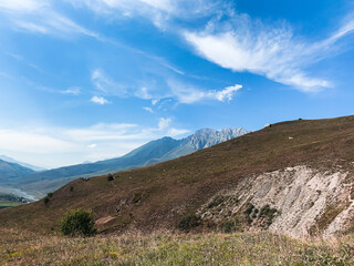 Fields in the mountains, natural colors, mountains background