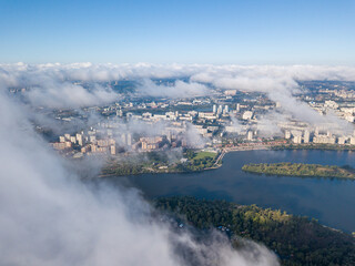 Fototapeta na wymiar Flying over autumn clouds in Kiev. Sunny morning.