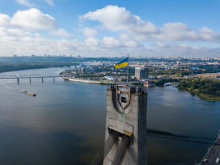 Aerial drone view. Flag of Ukraine on the North Bridge in Kiev.