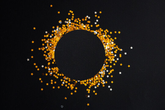 Many Gold Stars On A Black Background. Free Space For Text, Holiday And Party Concept