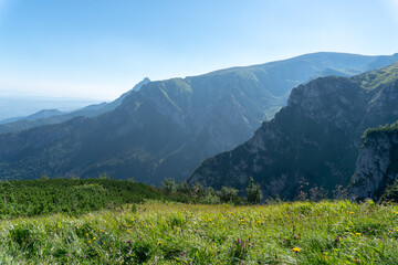 Panoramic view of the Polish Tatra peaks of the mountains during summer morning/noon.