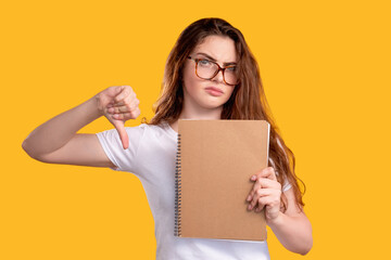 Disappointed teacher. Bad test result. Portrait of skeptic woman in glasses with blank beige...