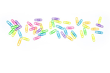 colored paper clips on a white background