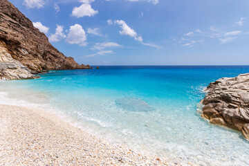 Fototapeta na wymiar Ikaria island, Greece. This is the Seychelles beach, the most popular and famous beach on Ikaria, in the southernwest part of the island.