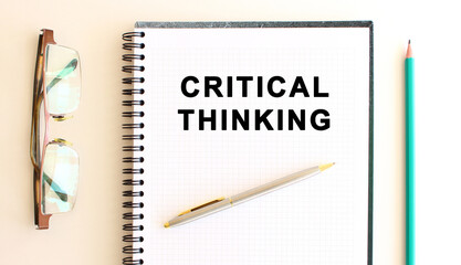 Notepad with text on a white background, near glasses and pencil. Business concept.