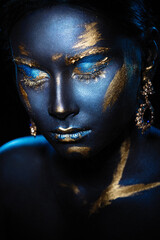 Portrait of a beautiful girl with an exquisite fantasy makeup in the style of legends about ancient greece and pharaohs
