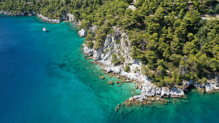 Aerial drone photo of beautiful cave with crystal clear turquoise sea in island of Skopelos visited...