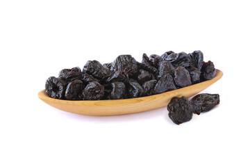 Dried prunes in dish isolated on white