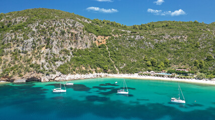 Aerial drone photo of popular crystal clear turquoise beach of Limnonari a safe sail boat...