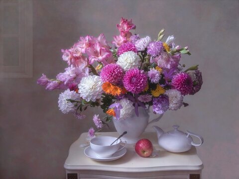 Still life with luxurious bouquet of flower on tea table