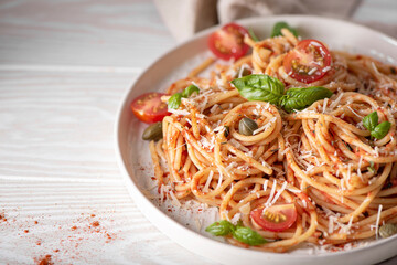 spaghetti with tomato sauce, basil and parmesan