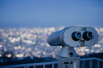 View from top of Mt. Moiwa in Sapporo city, Hokkaido, Japan during winter with night cityscape blur...