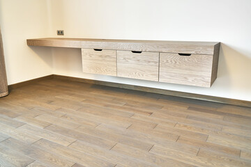 Modern furniture. Wall mounted wooden dressing table in contemporary bedroom